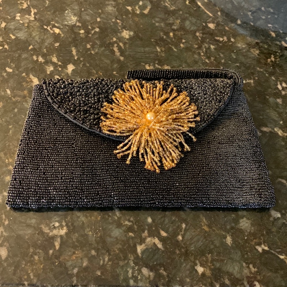 Black beaded clutch with gold beaded flower